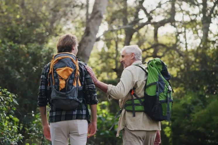 A father and son on a walk in the forest