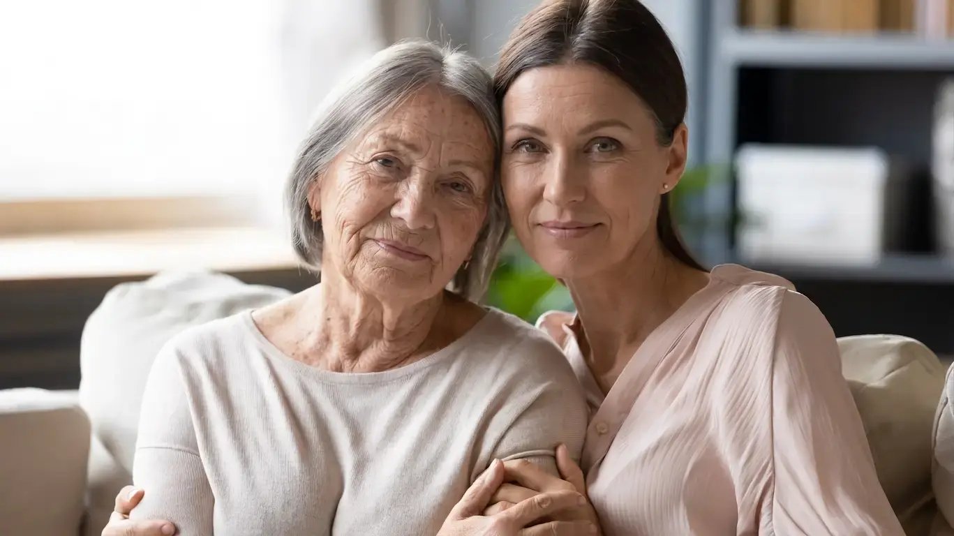 Two women looking at the camera, slightly smiling