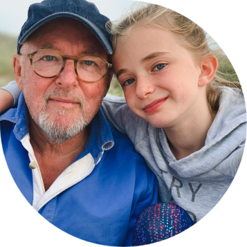 Grandad and grandaughter smiling