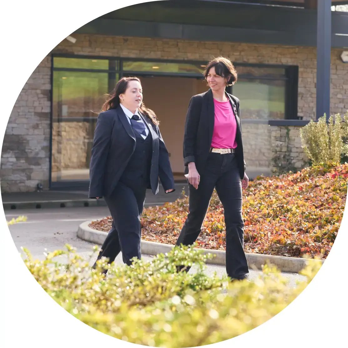 Laura and Chloe, staff at Pure Cremation, walking outside.