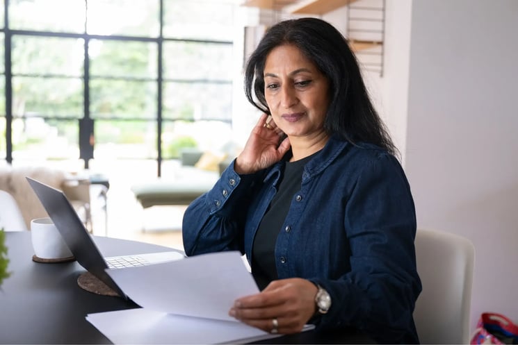 A woman looking at paperwork