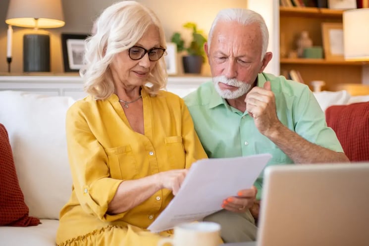 A man and woman looking at paperwork