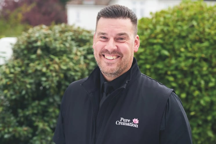 A smiling Pure Cremation team member